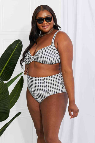 In a variety of colors and prints, this high-waisted bikini is sure to meet everyone's taste. The twist-front top is flirty and the high-rise bottoms are flattering.Marina West Swim Take A Dip Twist High-Rise Bikini in BlackPGST