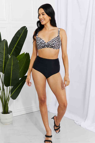 In a variety of colors and prints, this high-waisted bikini is sure to meet everyone's taste. The twist-front top is flirty and the high-rise bottoms are flattering.Marina West Swim Take A Dip Twist High-Rise Bikini in LeopardPGST