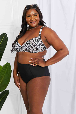 In a variety of colors and prints, this high-waisted bikini is sure to meet everyone's taste. The twist-front top is flirty and the high-rise bottoms are flattering.Marina West Swim Take A Dip Twist High-Rise Bikini in LeopardPGST