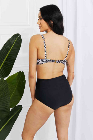 In a variety of colors and prints, this high-waisted bikini is sure to meet everyone's taste. The twist-front top is flirty and the high-rise bottoms are flattering.Marina West Swim Take A Dip Twist High-Rise Bikini in LeopardPGST