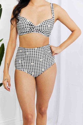 In a variety of colors and prints, this high-waisted bikini is sure to meet everyone's taste. The twist-front top is flirty and the high-rise bottoms are flattering.Marina West Swim Take A Dip Twist High-Rise Bikini in BlackPGST