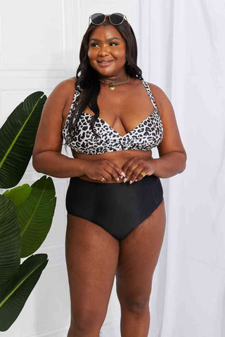 In a variety of colors and prints, this high-waisted bikini is sure to meet everyone's taste. The twist-front top is flirty and the high-rise bottoms are flattering.Marina West Swim Take A Dip Twist High-Rise Bikini in LeopardPGST