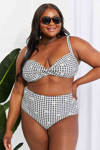 In a variety of colors and prints, this high-waisted bikini is sure to meet everyone's taste. The twist-front top is flirty and the high-rise bottoms are flattering.Marina West Swim Take A Dip Twist High-Rise Bikini in BlackPGST