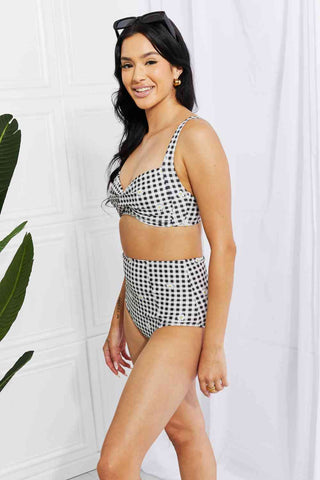 In a variety of colors and prints, this high-waisted bikini is sure to meet everyone's taste. The twist-front top is flirty and the high-rise bottoms are flattering.Marina West Swim Take A Dip Twist High-Rise Bikini in BlackPGST