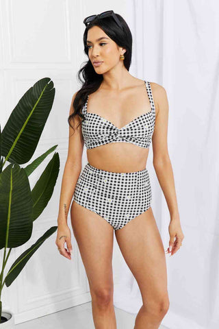 In a variety of colors and prints, this high-waisted bikini is sure to meet everyone's taste. The twist-front top is flirty and the high-rise bottoms are flattering.Marina West Swim Take A Dip Twist High-Rise Bikini in BlackPGST