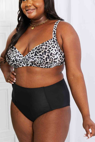 In a variety of colors and prints, this high-waisted bikini is sure to meet everyone's taste. The twist-front top is flirty and the high-rise bottoms are flattering.Marina West Swim Take A Dip Twist High-Rise Bikini in LeopardPGST