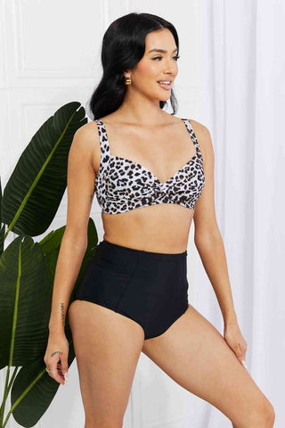 In a variety of colors and prints, this high-waisted bikini is sure to meet everyone's taste. The twist-front top is flirty and the high-rise bottoms are flattering.Marina West Swim Take A Dip Twist High-Rise Bikini in LeopardPGST