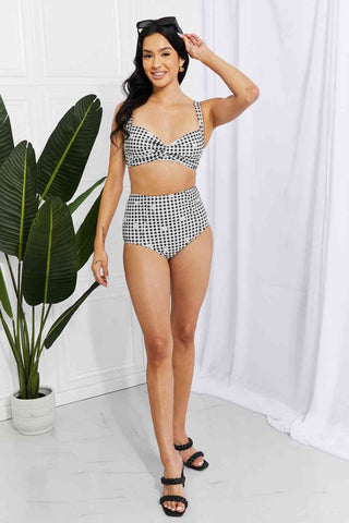 In a variety of colors and prints, this high-waisted bikini is sure to meet everyone's taste. The twist-front top is flirty and the high-rise bottoms are flattering.Marina West Swim Take A Dip Twist High-Rise Bikini in BlackPGST