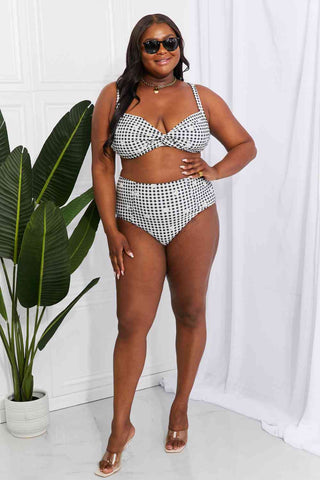 In a variety of colors and prints, this high-waisted bikini is sure to meet everyone's taste. The twist-front top is flirty and the high-rise bottoms are flattering.Marina West Swim Take A Dip Twist High-Rise Bikini in BlackPGST