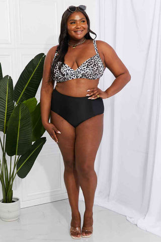 In a variety of colors and prints, this high-waisted bikini is sure to meet everyone's taste. The twist-front top is flirty and the high-rise bottoms are flattering.Marina West Swim Take A Dip Twist High-Rise Bikini in LeopardPGST